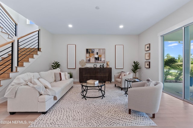 living room with light hardwood / wood-style flooring