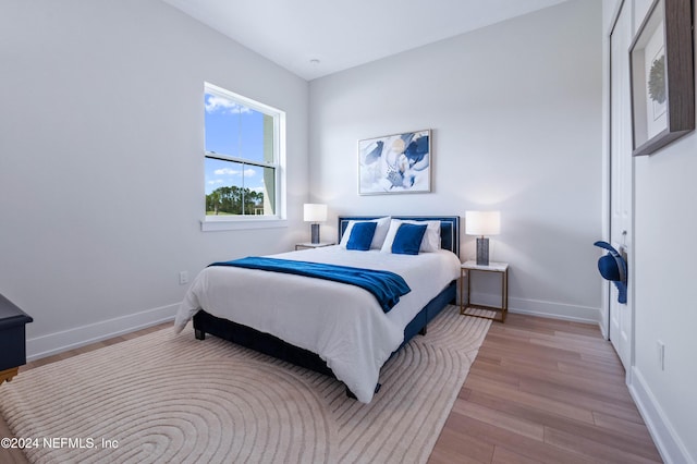 bedroom with light hardwood / wood-style flooring