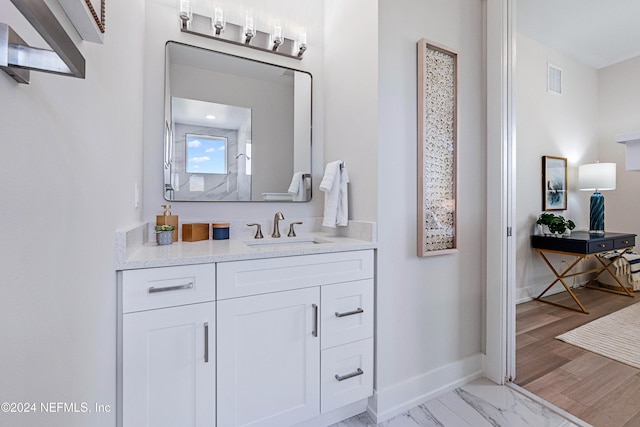 bathroom with vanity and walk in shower