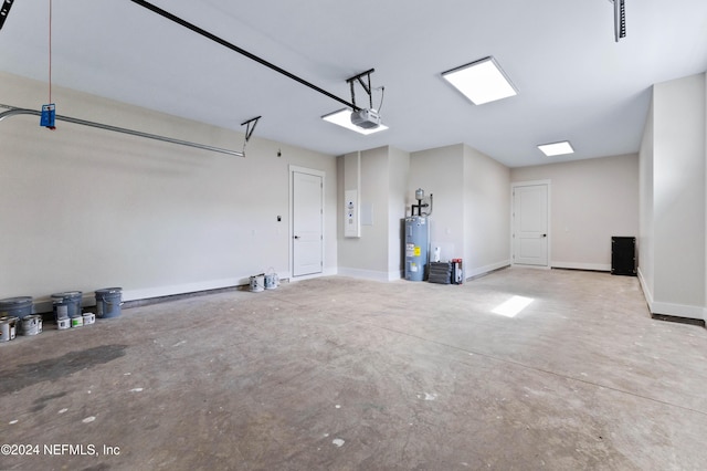 garage with electric water heater and a garage door opener