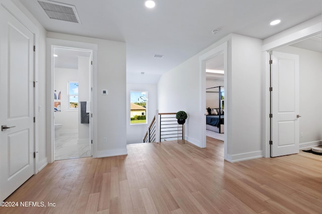 hallway with light wood-type flooring