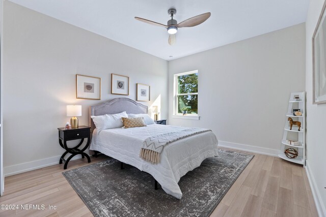 bedroom featuring light hardwood / wood-style floors and ceiling fan