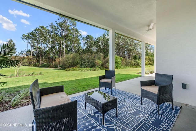 view of patio / terrace featuring ceiling fan