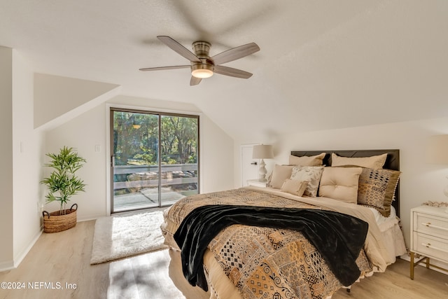 bedroom featuring vaulted ceiling, ceiling fan, access to exterior, and light hardwood / wood-style floors