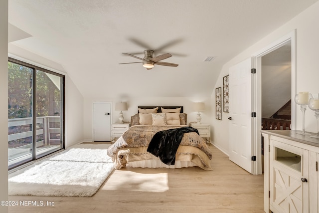 bedroom featuring vaulted ceiling, ceiling fan, access to exterior, and light wood-type flooring