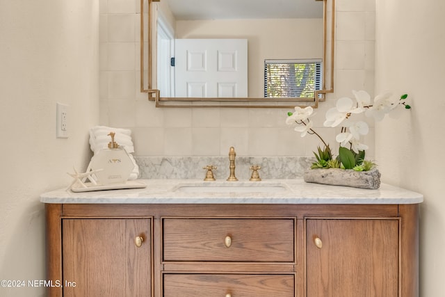 bathroom featuring backsplash and vanity