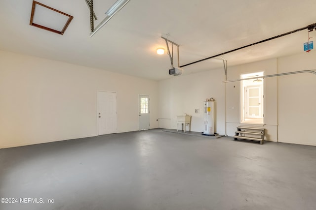 garage with sink, water heater, and a garage door opener