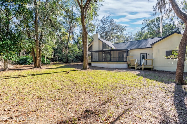 view of yard with a sunroom