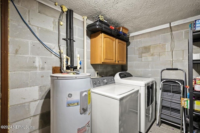 laundry room with cabinets, washer and dryer, and water heater