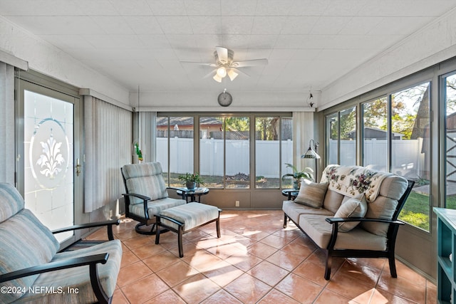 sunroom with a wealth of natural light and ceiling fan