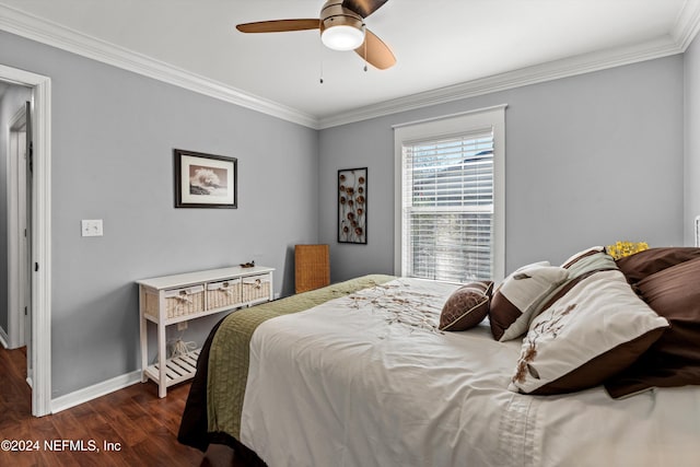 bedroom featuring dark hardwood / wood-style floors, ceiling fan, and crown molding