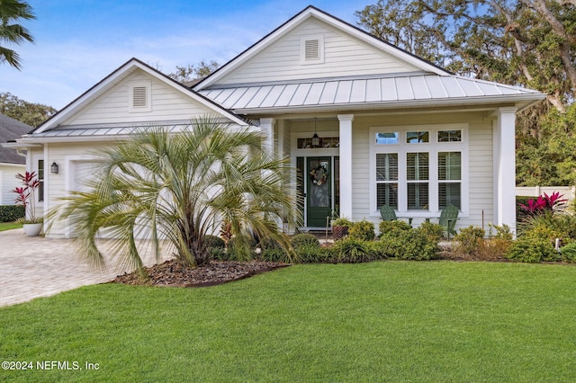 view of front facade with a front yard and a garage