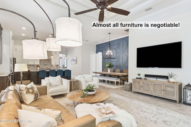 living room with crown molding, light hardwood / wood-style flooring, and ceiling fan with notable chandelier