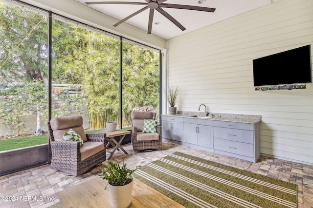 sunroom featuring sink