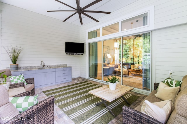 view of patio / terrace with area for grilling, ceiling fan, and sink