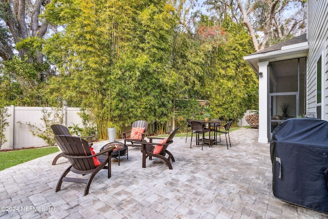 view of patio featuring area for grilling and an outdoor fire pit