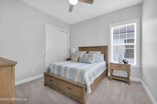 carpeted bedroom with a closet and ceiling fan