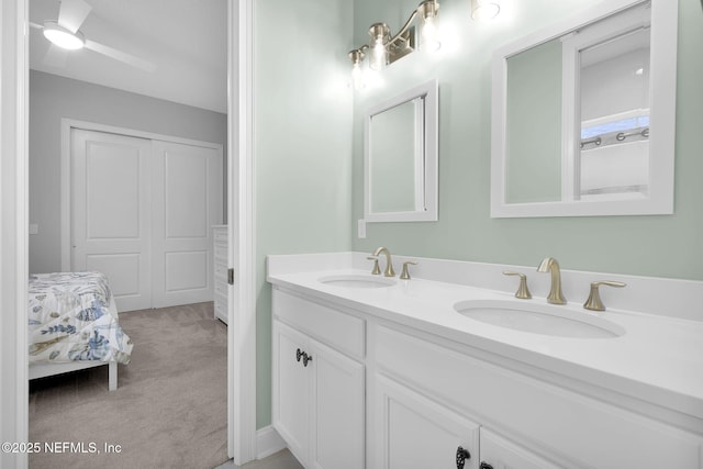 bathroom featuring ceiling fan and vanity