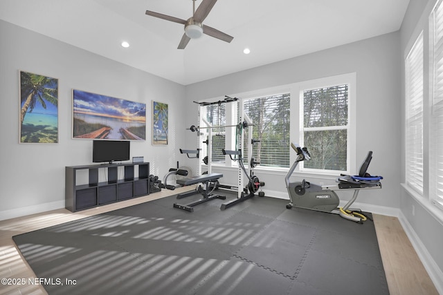 workout area featuring ceiling fan and lofted ceiling