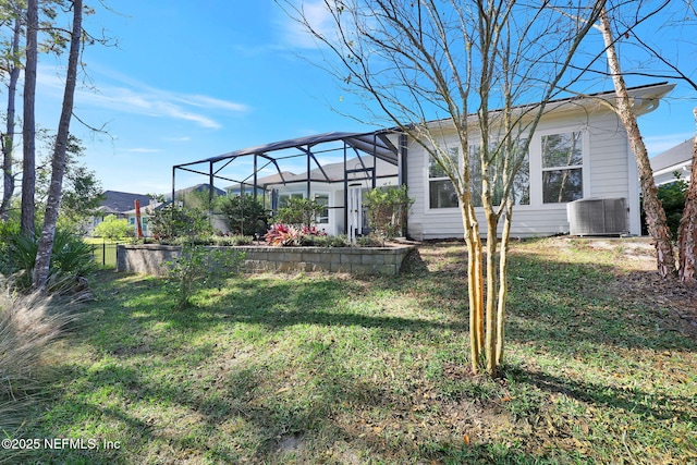 view of yard with a lanai and cooling unit