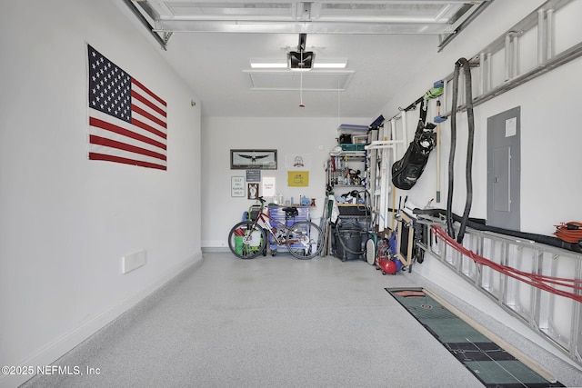 garage featuring electric panel and a garage door opener