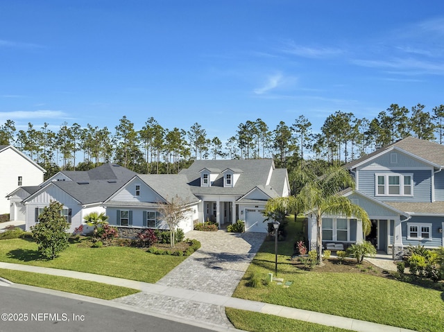 view of front facade featuring a front yard and a garage