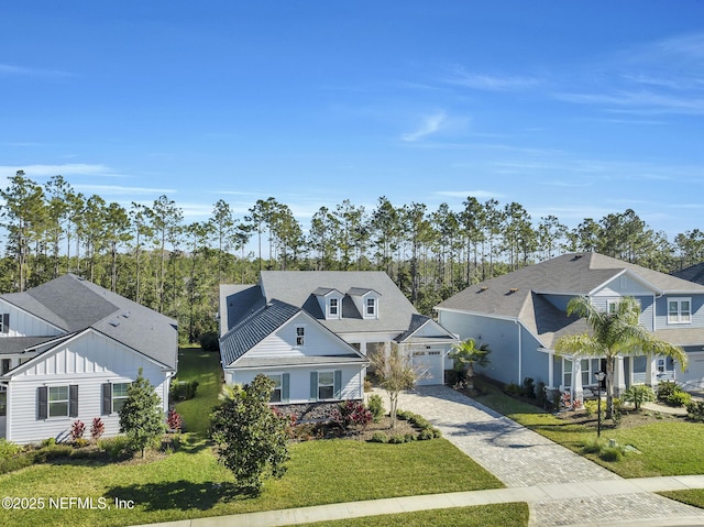 view of front of home featuring a garage and a front lawn