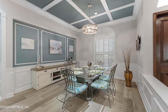 dining area featuring coffered ceiling, crown molding, light wood-type flooring, beamed ceiling, and a chandelier