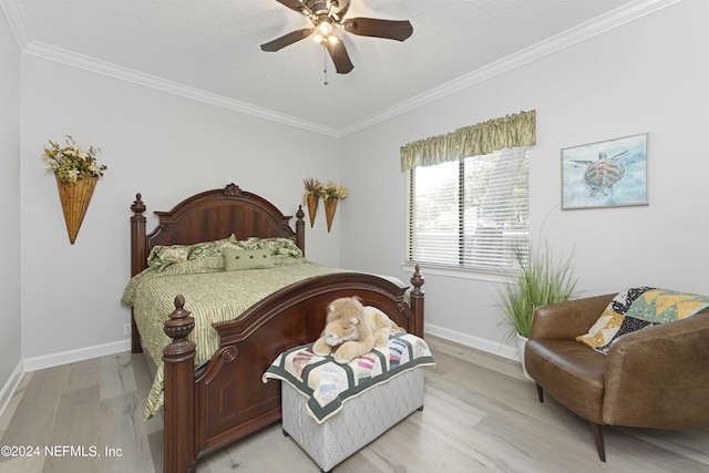 bedroom featuring light hardwood / wood-style floors, ceiling fan, and ornamental molding