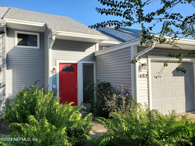 entrance to property featuring a garage