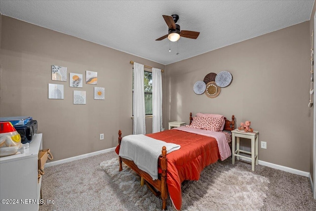 bedroom with carpet flooring, a textured ceiling, and ceiling fan