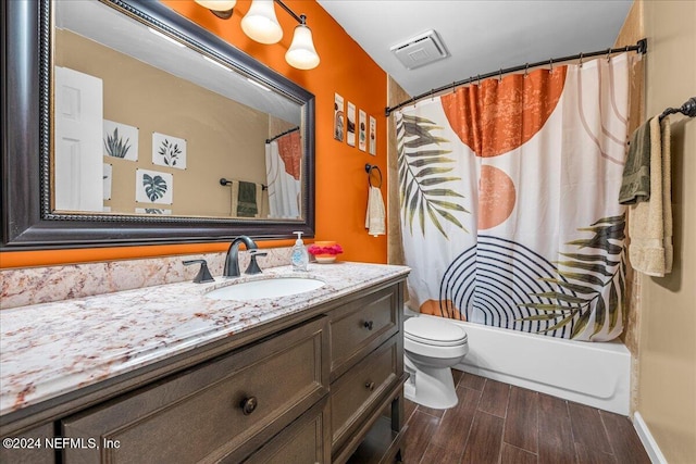 full bathroom featuring vanity, toilet, and shower / bath combo with shower curtain