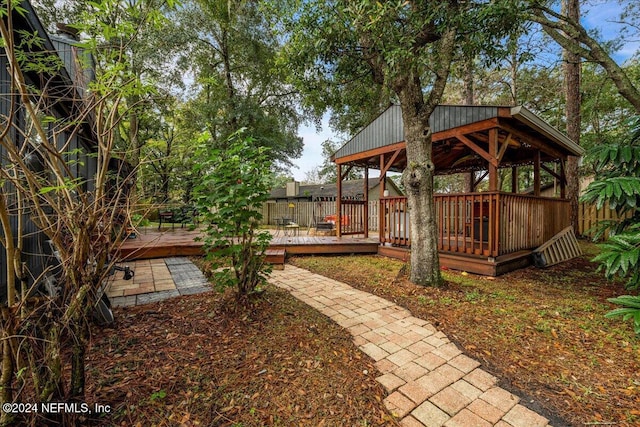 view of yard featuring a gazebo and a wooden deck