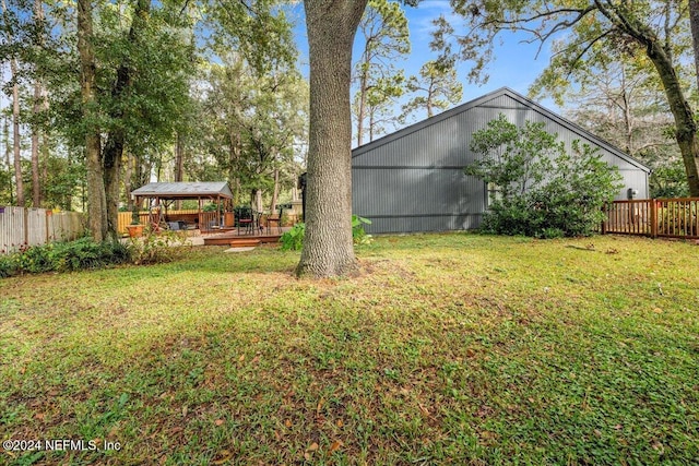 view of yard featuring a gazebo and a deck