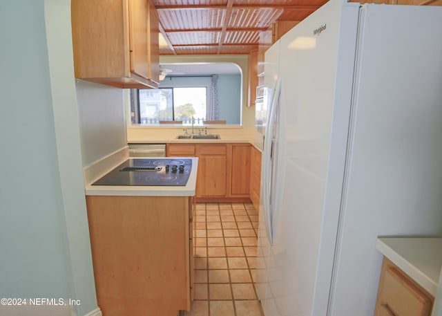 3145 Coastal Hwy Unit 1138, Saint Augustine, FL 32084 - kitchen featuring light brown cabinets, sink, white fridge with ice dispenser, light tile patterned floors, and black electric cooktop