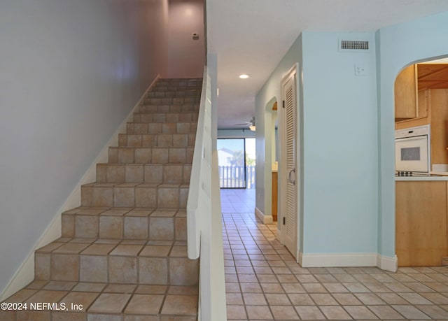 3145 Coastal Hwy Unit 1138, Saint Augustine, FL 32084 - stairway with tile patterned floors and ceiling fan