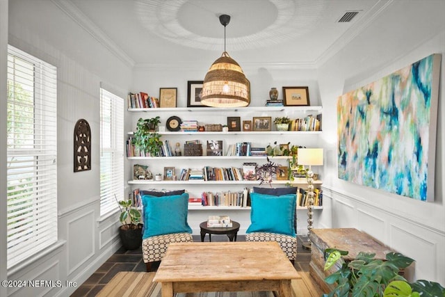 sitting room featuring crown molding