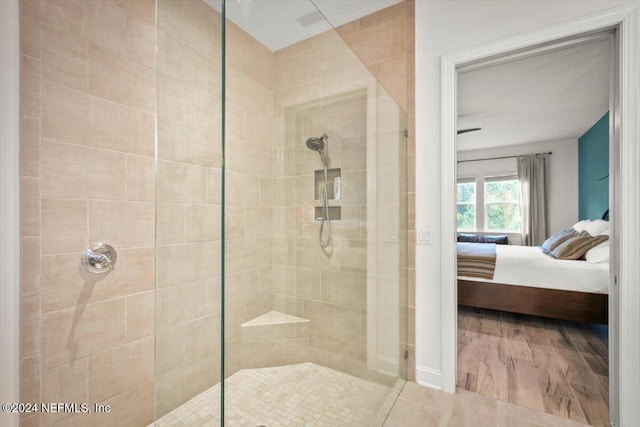 bathroom with a tile shower