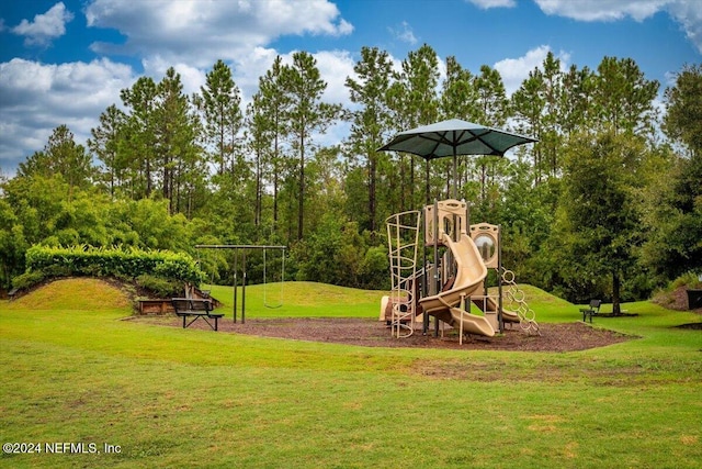 view of jungle gym featuring a lawn