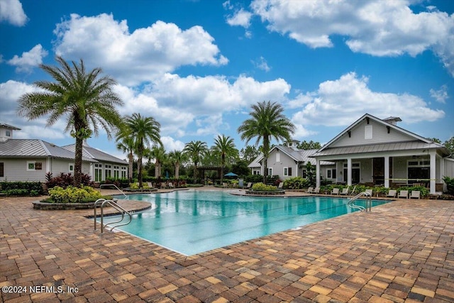 view of swimming pool with a patio