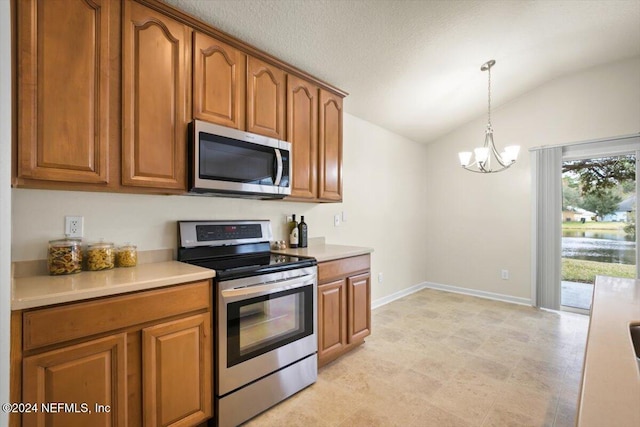 kitchen featuring decorative light fixtures, stainless steel appliances, an inviting chandelier, and lofted ceiling