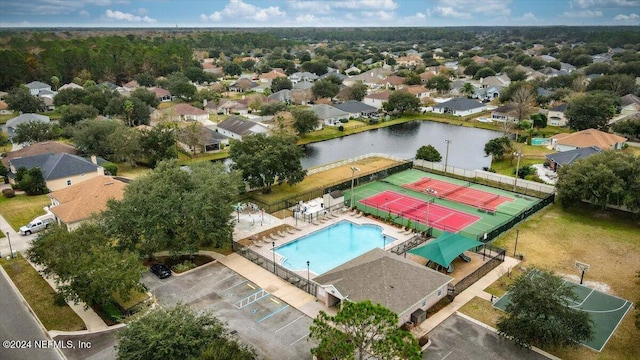 bird's eye view featuring a residential view and a water view