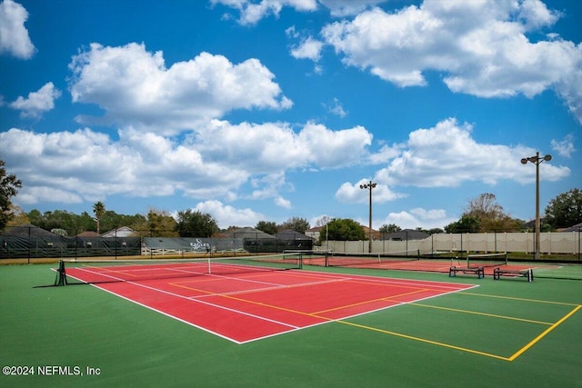 view of sport court featuring community basketball court and fence