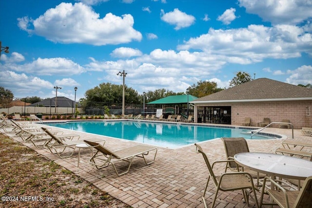 view of swimming pool featuring a patio