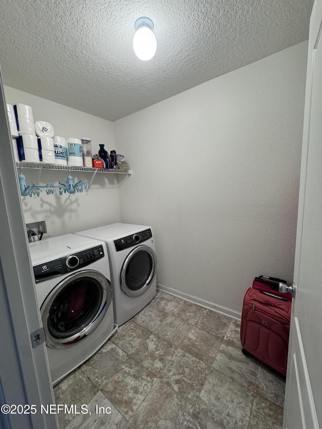 laundry area with washing machine and dryer