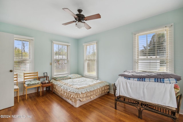 bedroom featuring hardwood / wood-style floors and ceiling fan