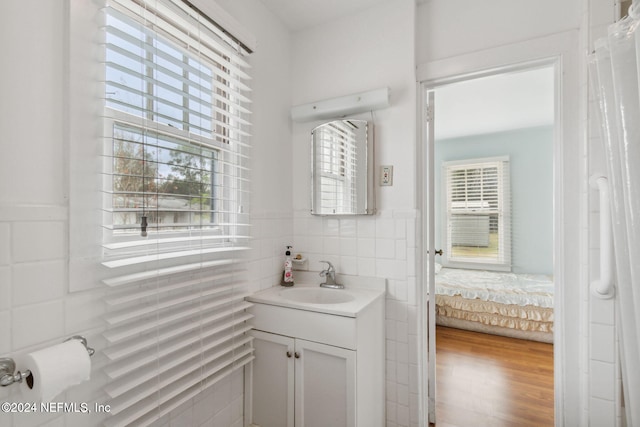 bathroom featuring hardwood / wood-style floors and vanity