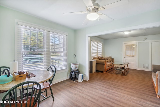 dining space featuring light hardwood / wood-style floors and ceiling fan