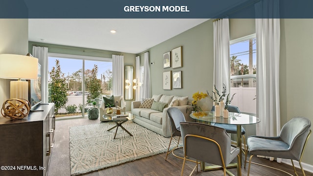 living room with a wealth of natural light and hardwood / wood-style floors