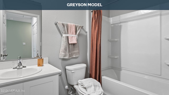 full bathroom featuring shower / bath combo with shower curtain, vanity, and toilet